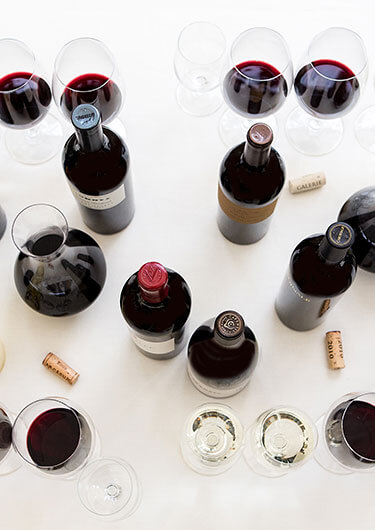 Spire wines on a table with wine glasses